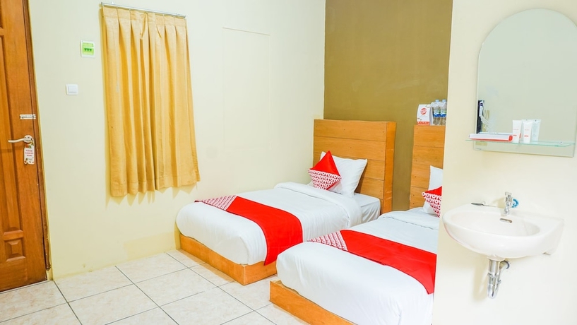 Imagen de la habitación del Hotel Super OYO 1340 Wisma Alamanda. Foto 13