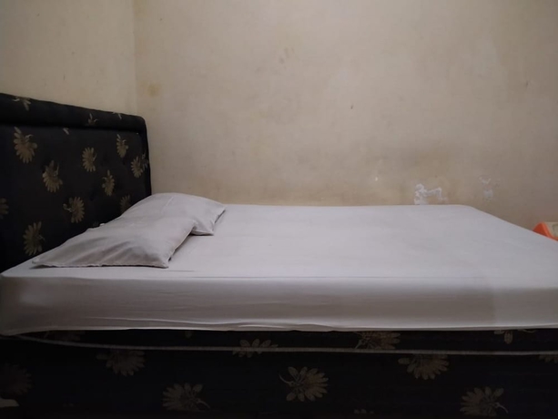 Imagen de la habitación del Hotel Super OYO 1340 Wisma Alamanda. Foto 15
