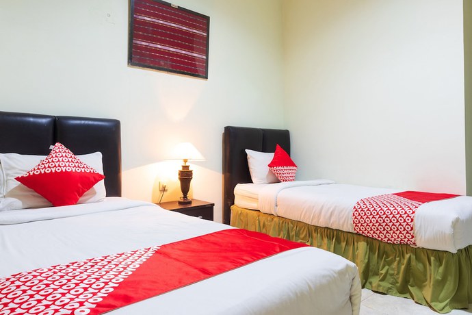 Imagen de la habitación del Hotel Super OYO 1682 Greenia. Foto 10