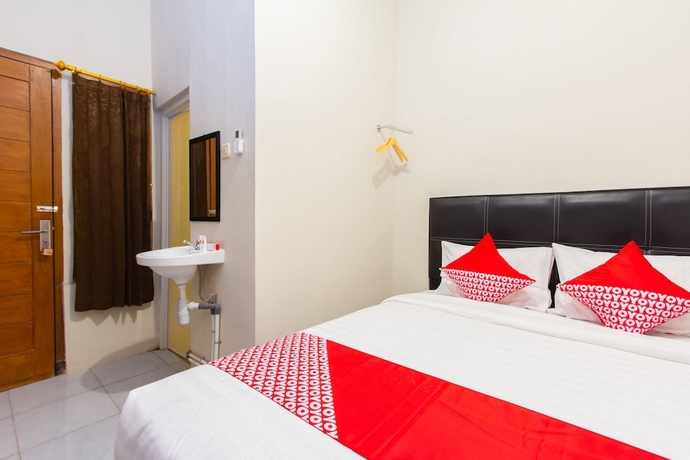 Imagen de la habitación del Hotel Super OYO 1718 Homestay Wak Gobenk. Foto 5