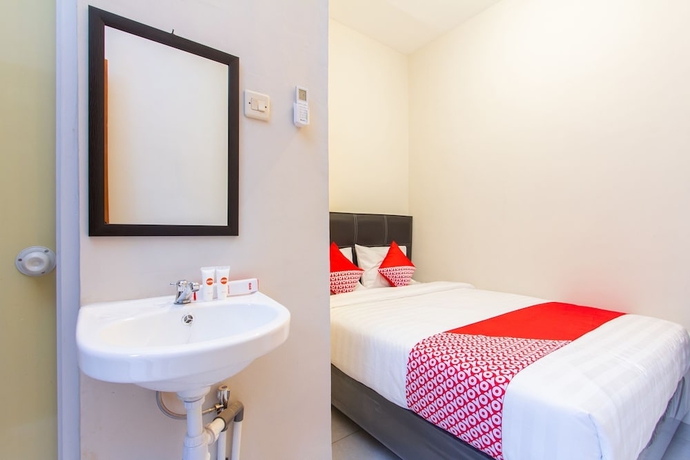 Imagen de la habitación del Hotel Super OYO 1718 Homestay Wak Gobenk. Foto 8