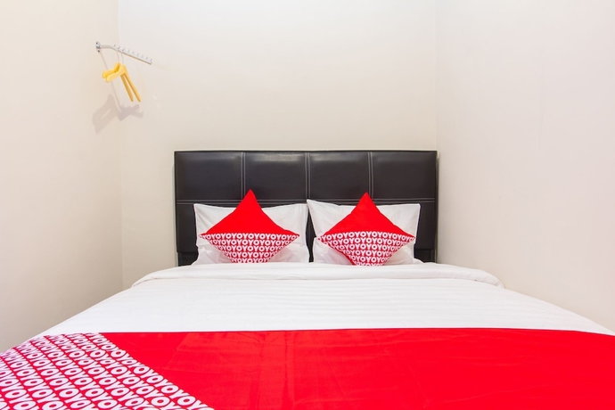 Imagen de la habitación del Hotel Super OYO 1718 Homestay Wak Gobenk. Foto 9