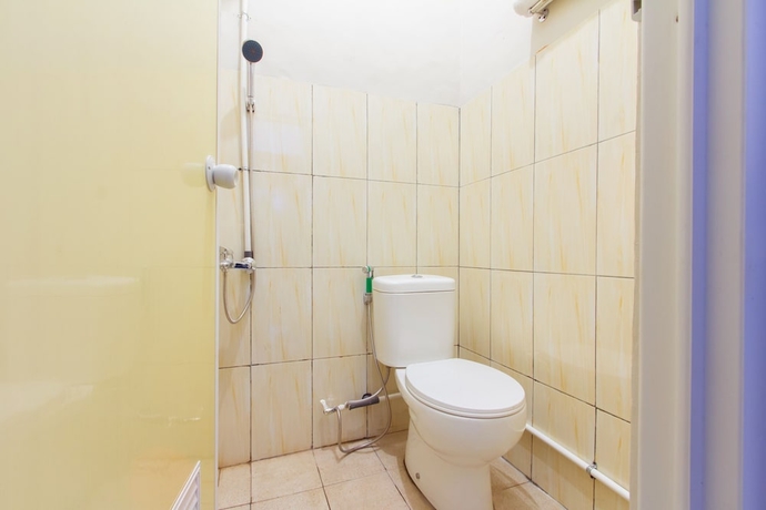 Imagen de la habitación del Hotel Super OYO 1718 Homestay Wak Gobenk. Foto 10