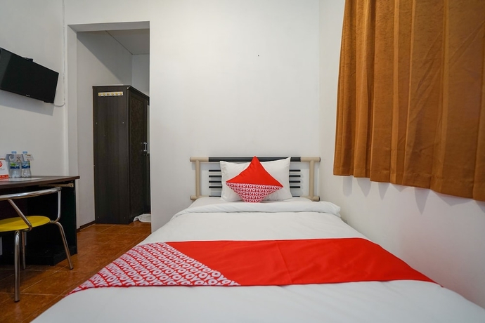 Imagen de la habitación del Hotel Super OYO 1844 Bravo Residence. Foto 8