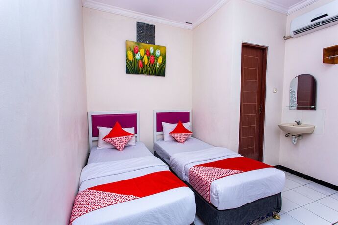 Imagen de la habitación del Hotel Super OYO 3042 Griya Karangsalam Indah. Foto 18