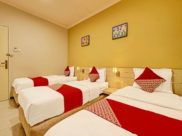Imagen de la habitación del Hotel Super OYO 389 Sky Guesthouse. Foto 14