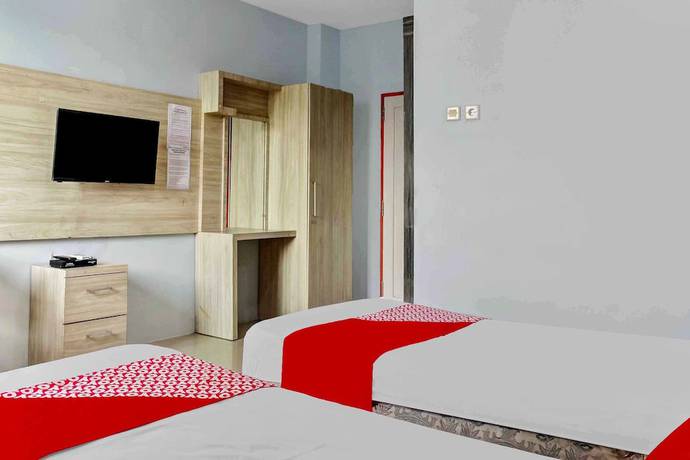 Imagen de la habitación del Hotel Super OYO 3903 Sweethome Syariah Guesthouse. Foto 6