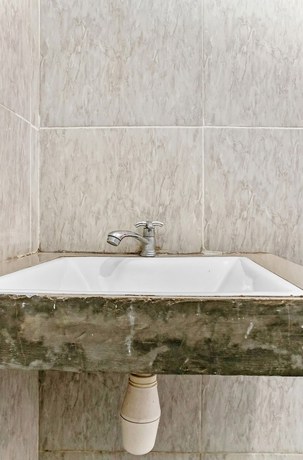 Imagen de la habitación del Hotel Super OYO 3903 Sweethome Syariah Guesthouse. Foto 11