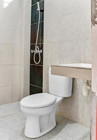 Imagen de la habitación del Hotel Super OYO 3903 Sweethome Syariah Guesthouse. Foto 12