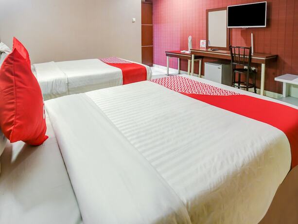 Imagen de la habitación del Hotel Super OYO 3936 Trisula Makassar. Foto 14