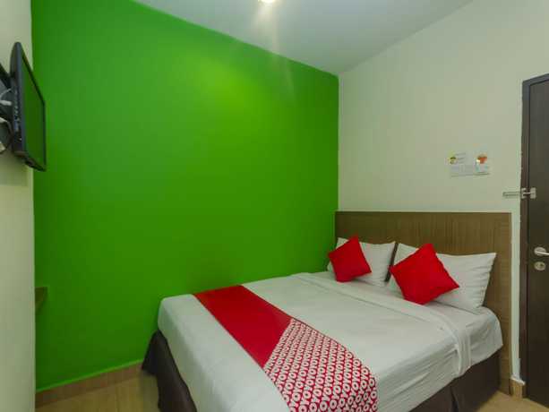 Imagen de la habitación del Hotel Super OYO 596 The Vintage. Foto 9