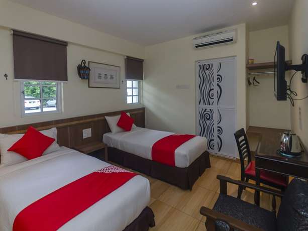 Imagen de la habitación del Hotel Super OYO 596 The Vintage. Foto 12