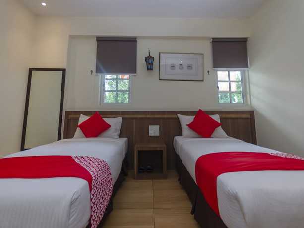 Imagen de la habitación del Hotel Super OYO 596 The Vintage. Foto 13