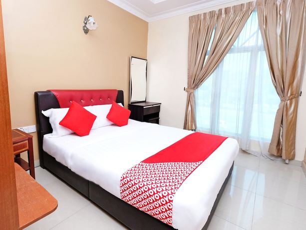 Imagen de la habitación del Hotel Super OYO 707 Ayuni. Foto 3
