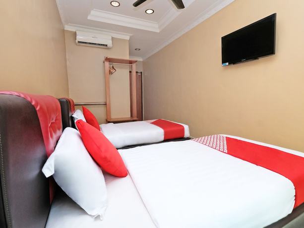 Imagen de la habitación del Hotel Super OYO 707 Ayuni. Foto 10