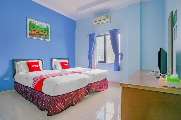 Imagen de la habitación del Hotel Super OYO 90072 Apri Inn Syariah. Foto 4