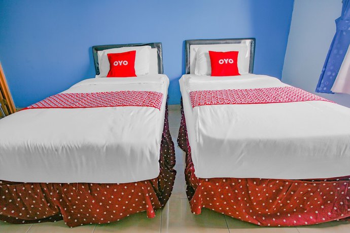 Imagen de la habitación del Hotel Super OYO 90072 Apri Inn Syariah. Foto 6