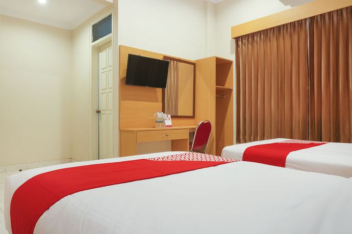 Imagen de la habitación del Hotel Super OYO 902 Pondok Anggun. Foto 7