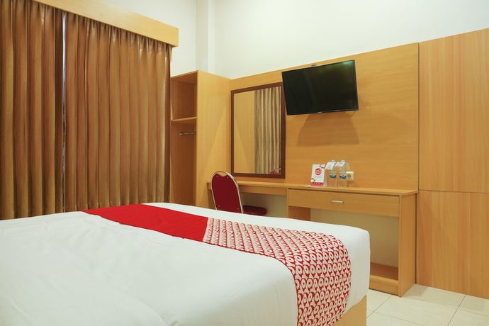Imagen de la habitación del Hotel Super OYO 902 Pondok Anggun. Foto 8