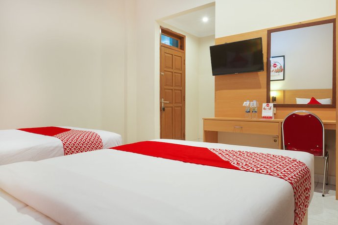 Imagen de la habitación del Hotel Super OYO 902 Pondok Anggun. Foto 9