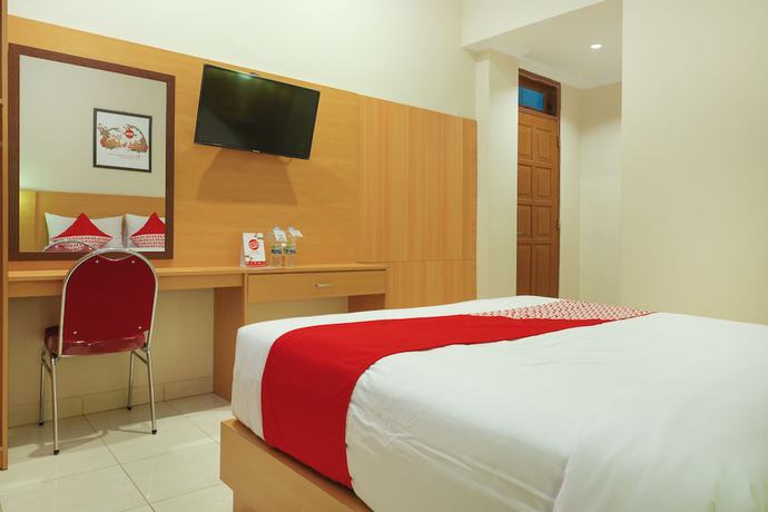 Imagen de la habitación del Hotel Super OYO 902 Pondok Anggun. Foto 14