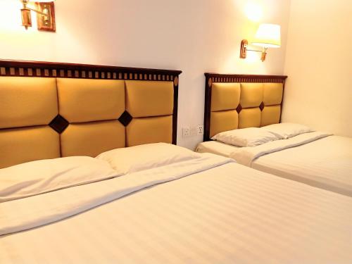 Imagen de la habitación del Hotel Super OYO 90464 Borneo Suites. Foto 20