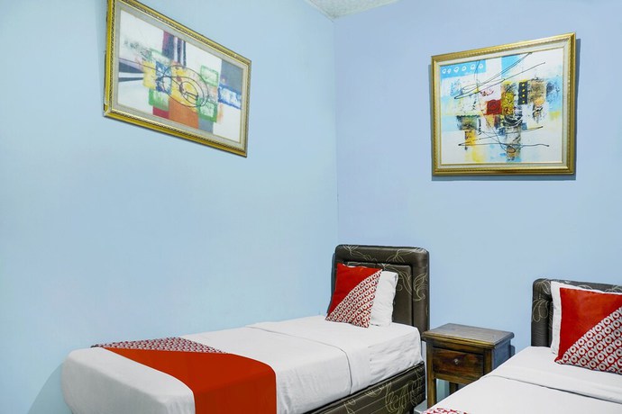 Imagen de la habitación del Hotel Super OYO 91188 Teratai Cikarang. Foto 9