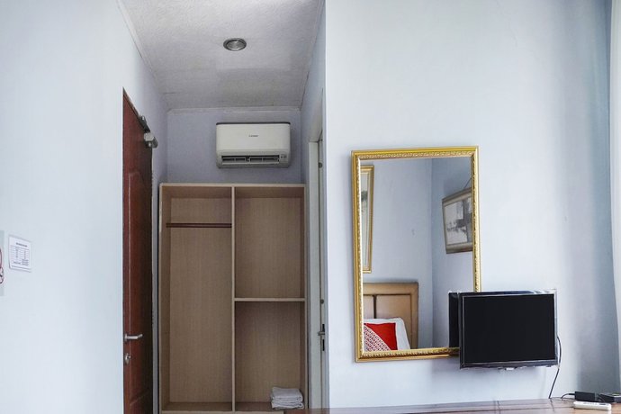 Imagen de la habitación del Hotel Super OYO 91188 Teratai Cikarang. Foto 11