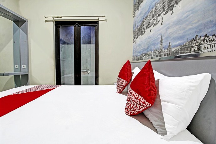 Imagen de la habitación del Hotel Super OYO 91202 Family Guest House Syaria. Foto 9