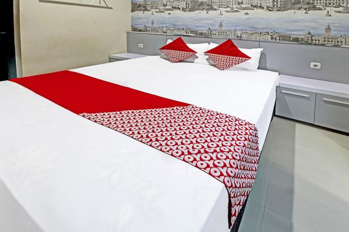 Imagen de la habitación del Hotel Super OYO 91202 Family Guest House Syaria. Foto 10