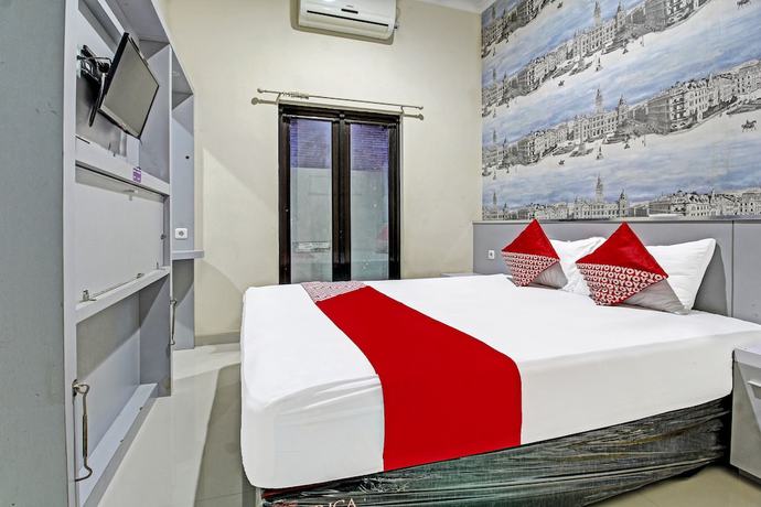 Imagen de la habitación del Hotel Super OYO 91202 Family Guest House Syaria. Foto 11