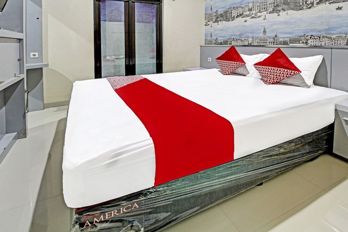 Imagen de la habitación del Hotel Super OYO 91202 Family Guest House Syaria. Foto 14