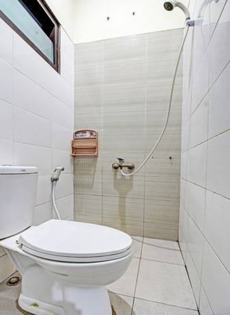 Imagen de la habitación del Hotel Super OYO 91202 Family Guest House Syaria. Foto 16