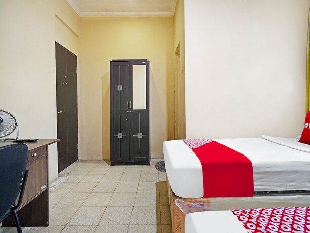 Imagen de la habitación del Hotel Super OYO 91350 Garden Hostel. Foto 17