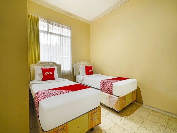 Imagen de la habitación del Hotel Super OYO 91350 Garden Hostel. Foto 20