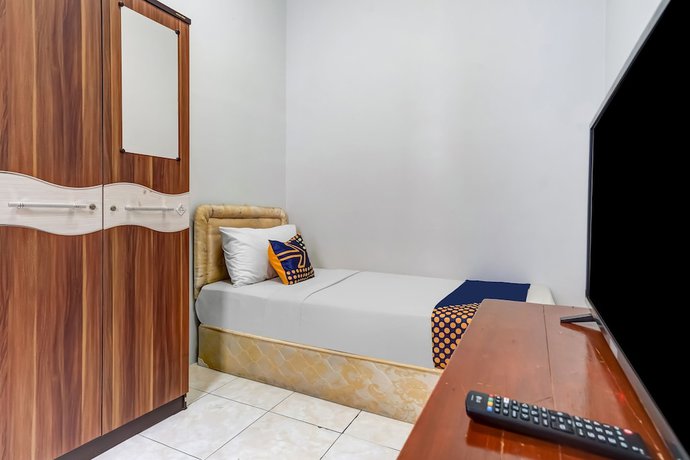 Imagen de la habitación del Hotel Super OYO 91366 The Chatter Place. Foto 8
