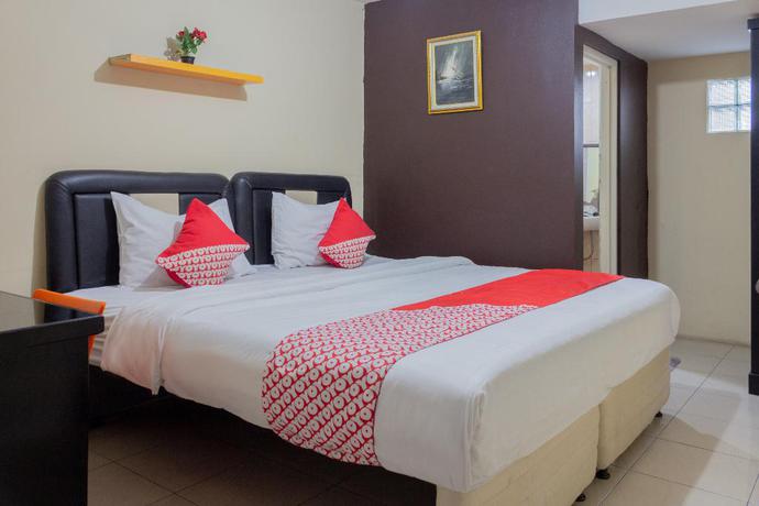 Imagen de la habitación del Hotel Super OYO 989 Audah Guesthouse Syariah. Foto 3