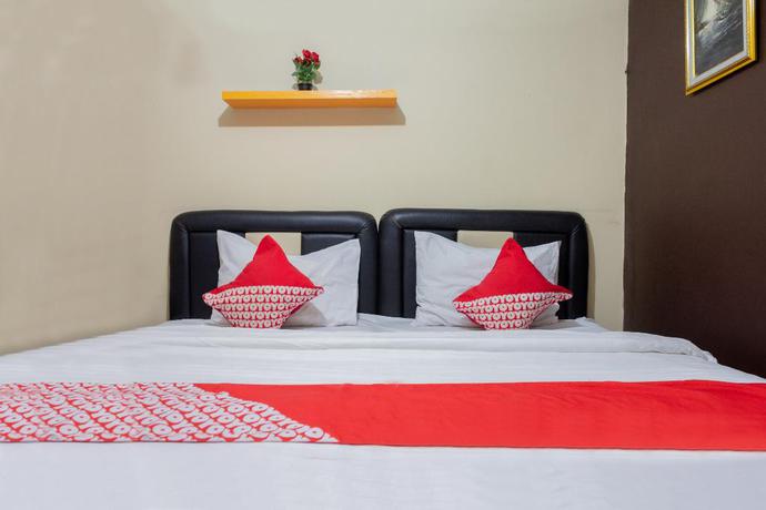 Imagen de la habitación del Hotel Super OYO 989 Audah Guesthouse Syariah. Foto 6