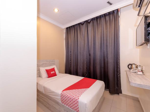 Imagen de la habitación del Hotel Super OYO Capital O 89366 Spring Inn Hotel. Foto 12