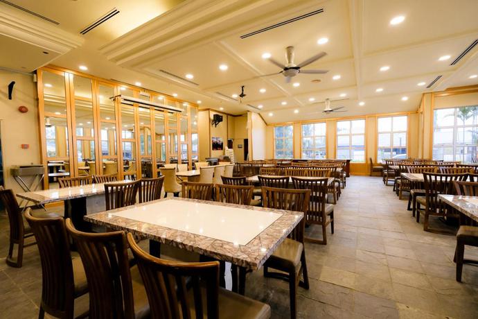 Imagen del bar/restaurante del Hotel Super OYO Capital O 90146 Alh Continental Resort. Foto 2