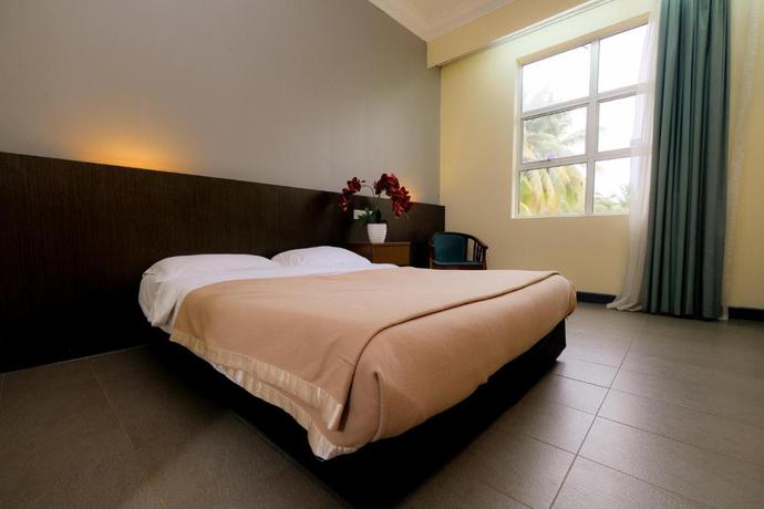 Imagen de la habitación del Hotel Super OYO Capital O 90146 Alh Continental Resort. Foto 5