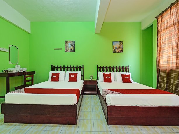 Imagen de la habitación del Hotel Super OYO Capital O 90659 Raintown Timbers. Foto 3