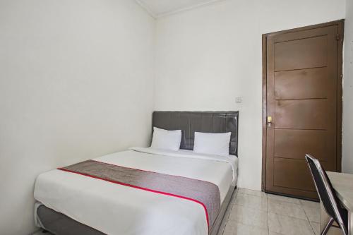 Imagen de la habitación del Hotel Super OYO Capital O 93909 Yasmin. Foto 19