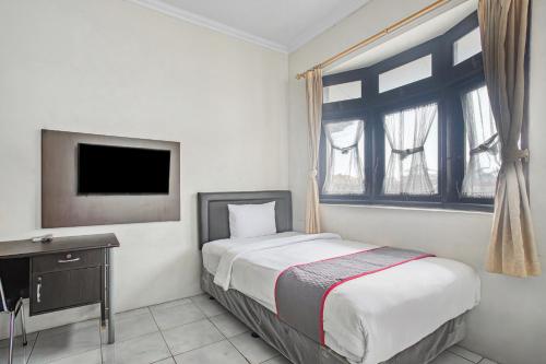 Imagen de la habitación del Hotel Super OYO Capital O 93909 Yasmin. Foto 20