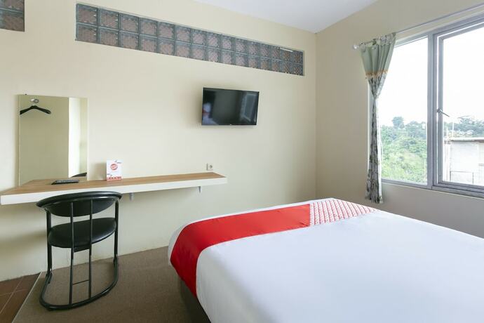 Imagen de la habitación del Hotel Super OYO Collection O 3130 D\'Valley View. Foto 18