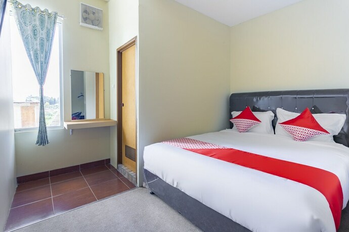 Imagen de la habitación del Hotel Super OYO Collection O 3130 D\'Valley View. Foto 20