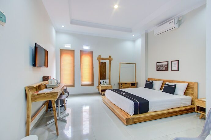 Imagen de la habitación del Hotel Super OYO Collection O 3280 Cendhani Raras. Foto 16