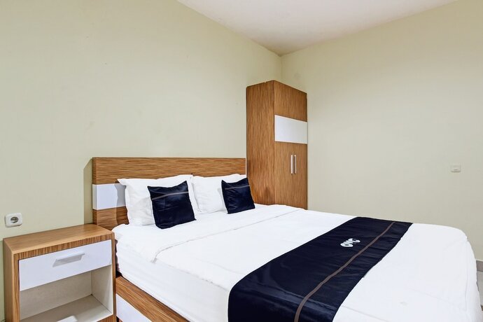 Imagen de la habitación del Hotel Super OYO Collection O 90253 DHelomi. Foto 18