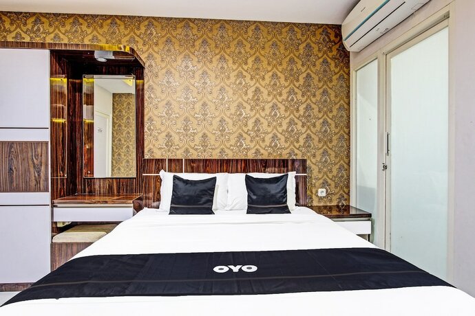 Imagen de la habitación del Hotel Super OYO Collection O 90253 DHelomi. Foto 19