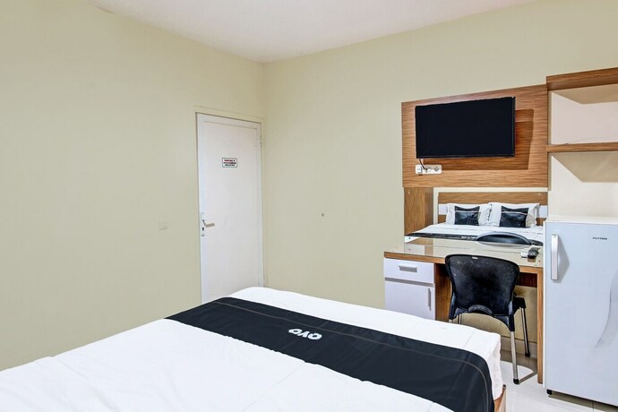 Imagen de la habitación del Hotel Super OYO Collection O 90253 DHelomi. Foto 20